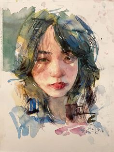 a watercolor painting of a woman's face