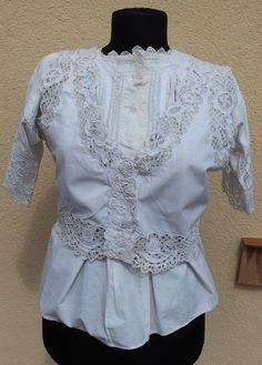 Antique Hungarian white vest with blouse hand embroidered S size If you are buying several pieces I can combine postage at the time of mailing. If you have any question please don't hesitate to contact me, My etsy shop: https://www.etsy.com/shop/TreasuryCoffer Fitted Traditional Blouse For Daywear, Victorian Fitted Tops For Summer, Fitted Victorian Tops For Summer, Fitted Victorian Summer Tops, Victorian Cotton Tops For Summer, Victorian White Cotton Top, Victorian Style White Cotton Top, Fitted Cotton Lace Top With Broderie Anglaise, Victorian Cotton Tops With Lace Trim