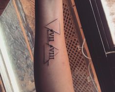 a person with a tattoo on their arm that reads, faithly and an arrow