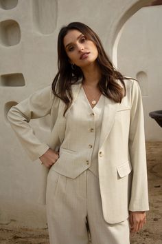 This mélange beige blazer stands out as a warm-weather take on classic tailored style. It's got a single-button closure, plus timeless details for a polished finish. •Padded shoulders •Notched lapels •Chest pocket •Two hip pockets •Single-button closure Item Number: 24957 Beige Suits Women, Beige Blazer Outfits Women, Blazer Outfits Women, Beige Jumpsuit, Tailored Style, Fashionable Work Outfit, Blazer Outfits For Women, Beige Suits, Beige Blazer