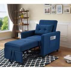 a blue recliner chair and ottoman in a living room