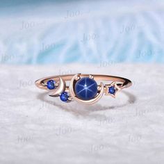 Star Blue Sapphire Engagement Ring Unique 5mm Round Star Blue Wedding Rings Rose Gold Celestial Moon Blue Sapphire Ring Unique Promise Gifts The waning moon is believed to be a good time for clearing negative influences. This simple, ready to wear ring allows you to keep the spirit of the moon with you always. The moon engagement rings are a popular choice, represents I LOVE YOU TO THE MOON AND BACK , used to express the vastness of one's affection for another. 30 days non-hassle return policy. Celestial Ring Wedding, Celestial Sapphire Wedding Ring, Celestial Style Sapphire Wedding Ring, Celestial Style Round Sapphire Ring, Blue Star-shaped Celestial Jewelry, Celestial Blue Star-shaped Jewelry, Celestial Blue Sapphire Promise Ring, Blue Celestial Sapphire Promise Ring, Celestial Blue Ring As A Gift