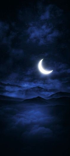 the moon is shining brightly in the night sky above some clouds and mountains, with dark blue hues