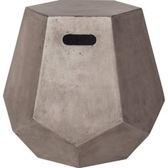 a cement birdhouse with a hole in the middle