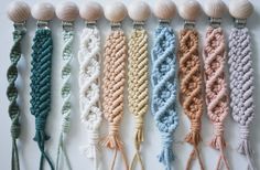 six different colors of macrame with shells in the backgroung and on each side