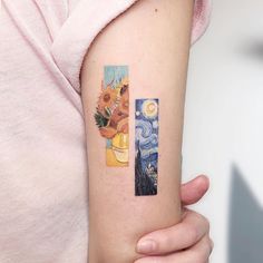 a person with a tattoo on their arm holding up a piece of art that looks like the cross