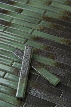 a cross laying on top of a tiled floor