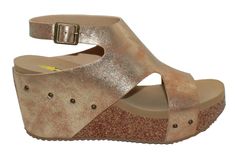 PRICES MAY VARY. Faux leather or metallic faux leather upper with metal buckle closure and studd accents Synthetic lining Signature ultra comfort EVA insole Cork 2.75” wedge with rubber traction outsole Volatile Shoes, Athletic Sandals, Sandals Casual, High Wedges, Pool Side, Studded Heels, Ankle Strap Wedges, Wedge Sneakers, Wedge Sandal