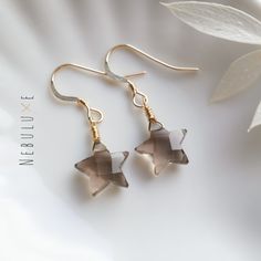 Smoky quartz star crystal earrings, April birthstone earrings, 10th Anniversary gift, Star earrings, Celestial earrings, Virgo zodiac jewelry ◦ All of the stones used in our jewelry are 100% genuine. These smoky quartz stones are expertly cut and shaped into a star ◦ Comes on your choice of 925 sterling silver or 14m gold filled ear hooks which are comfortable for all-day wear and great for sensitive ears ◦ Each stone varies in size (typically 10x10mm), shape, and color so please do expect some Star-shaped Crystal Earrings For Gifts, Star-shaped Earrings With Lever Back For Gifts, Smokey Quartz Jewelry, Smoky Quartz Earrings, 10th Anniversary Gifts, Star Crystal, Celestial Earrings, Earrings Star, Sacred Stones