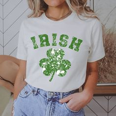 St Patricks Day Irish Shamrock Shirt Women, Saint Patricks Day Irish Tshirt, Womens St Pattys Day Shirt, St Paddys Day Tee, Irish Gifts We use the softest, lightest and most comfortable shirt available, the Bella Canvas 3001.  It's everyone's favorite tshirt.  This classic unisex jersey short sleeve shirt fits like a well-loved favorite. Soft cotton and quality print make users fall in love with it over and over again. These t-shirts have-ribbed knit collars to bolster shaping. The shoulders have taping for better fit over time. Dual side seams hold the garment's shape for longer.  Since this Bella Canvas 3001 shirt is unisex in size, if you want a tighter fit, pick one size down.  Or you may also pull out your favorite shirt and compare it's size with our size chart, which you can find in Cotton Top With Letter Print For St. Patrick's Day, St. Patrick's Day Cotton T-shirt With Letter Print, Irish Tshirts, St Paddys, Irish Shamrock, Shamrock Shirt, St. Patricks Day, Irish Gifts, Saint Patricks