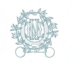 a monogrammed wreath with the letter m in it