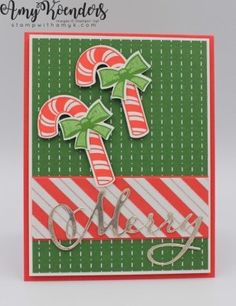 a christmas card with candy canes on it