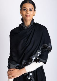 Add a touch of glamour to your collection with this uniquely designed contemporary black scarf, featuring a stunning tonal scalloped sequin and frill border. The intricate sequin detailing adds a subtle shimmer, while the frill border introduces a delicate, feminine touch. Made from luxuriously soft cashmere, this scarf provides warmth and style, making it perfect for an evening out. This chic and versatile piece is the perfect accessory to effortlessly elevate your look whilst making a heads tu Black Cashmere Scarf, Delicate Feminine, Black Scarf, Cashmere Scarf, No Frills, Sequin, Cashmere, Wardrobe, Black