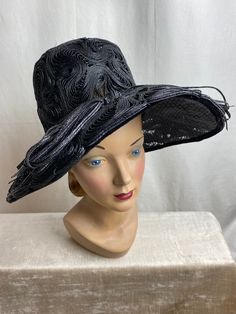 "I just love this hat. It's absolutely beautiful. Very striking, in excellent condition. No flaws noted. Black woven straw type material with a lacy nylon base. A very deep hat with a very wide brim. It's a bit timeless. It has a sheer lacy Look. Breathable. Gorgeous! ✏️ ✏️✏️DETAILS ✏️✏️✏️ Brand: see photo / Flirtette creation New York Size on tag: none Fits like: small (vintage size) Color: black Material: Woven straw & nylon material Condition: excellent Item includes: hat ✂ ✂️✂️ MEASUREMENTS Black High Crown Hat For Evening, Black Top Hat With Wide Brim For Evening, Black Wide Brim Top Hat For Evening, Black Evening Top Hat With Wide Brim, Black Straw Hat With Curved Brim For Evening, Black Straw Hat With Flat Brim For Party, Black Wide Brim Costume Hat For Evening, Black Wide Brim Costume Hat For Evening Events, Black Wide Brim Evening Costume Hat