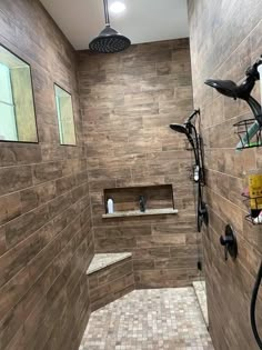 a walk in shower sitting inside of a bathroom