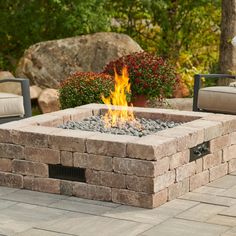 a fire pit sitting on top of a stone patio