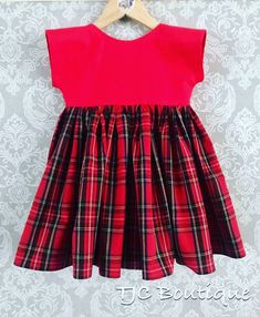 Beautiful block colour bodice with red tartan full skirt. Made from quality 100% cotton. Includes a hair bow accessory to match Classic Cotton Party Dress, Plaid Cotton A-line Dress, Classic Cotton Plaid Dress, Classic Plaid Cotton Dress, Classic Gingham Cotton Dresses, Classic Red Cotton Dress, Pink Fitted Plaid Cotton Dress, Handmade Girls Dress, Twirly Skirt