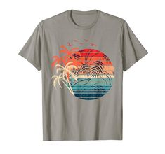 PRICES MAY VARY. If your favorite holiday is a tropical summer vacation then this design is exactly for you! Grab this design when your vacay mode is on or if you feel summer vibes on a tropical holiday trip to an exotic beach with sunset and coconut palm trees! Lightweight, Classic fit, Double-needle sleeve and bottom hem Tropical Graphic Print T-shirt For Beach, Tropical Print T-shirt For Beach, Tropical Print T-shirt For Vacation, Multicolor Hawaiian T-shirt For Summer, Summer Vacation T-shirt With Front Print, Summer Multicolor T-shirt With Front Print, Multicolor Summer T-shirt With Front Print, Multicolor Front Print T-shirt For Summer, Tropical T-shirt For Beach Vacation