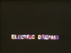 the words electric dreams are lit up in front of a black background with white and red letters