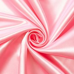 a close up view of pink satin fabric