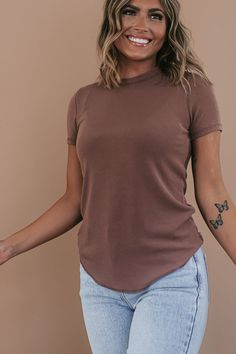 Our Basic Ribbed Tees are crafted from a stretchy ribbed fabric that is oh-so-comfortable. This piece features a full-length fit and a rounded hemline. An ideal basic meant for year-round wear. Neckline: Round Fabric: 65% Rayon, 30% Polyester, 5% Spandex Comfortable stretch Sizing (based on standard sizing): S (4/6) M (8/10) L (10/12) Designed with generous stretch fabrication and crafted to have a slimming true to size fit Model Specs: Emily is wearing a size small in the photo.How will this it Spring Plain Stretch T-shirt, Everyday Ribbed T-shirt, Basic Stretch Tops In Solid Color, Basic Stretch Solid Color Tops, Basic Solid Color Stretch Tops, Stretch T-shirt For Loungewear, Casual Stretch Tops In Specific Color, Stretch Solid Color T-shirt For Fall, Stretch Casual Tops