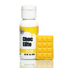 a bottle of yellow paint next to a block of wax on a white surface with the word choc fite below it