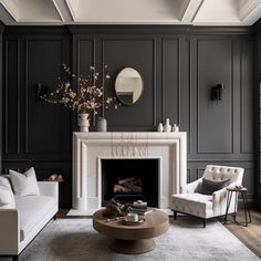 a living room filled with furniture and a fire place in front of a mirror on the wall