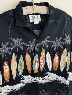 Pre-owned Ky’s Hawaiian shirt. It’s black with rows of surfboards across the chest. The sleeves & back have the same design in smaller pattern. There are palm trees & ocean waves. Great for summer! Approx. Measurements (laid flat): Tagged size XL 25.75in across underarms 30.25in neck to bottom Payment is due within 3 days of purchase or eBay will be notified for non-payment. First class shipping via USPS is included. Please review all photos & descriptions as I do not accept returns! Please send Black Hawaiian Shirt For Beach Season, Black Tropical Camp Shirt With Graphic Print, Tropical Shirts, Beach Waves, Button Shirt, Ocean Waves, Hawaiian Shirt, Surfboard, Palm Trees