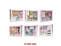 a set of four doll houses with furniture and accessories in pink boxes on a white background