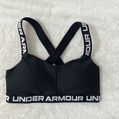 Women’s X-Small Sports Bra Under Armour It Is Brand New, Was Only Tried On Once. Tags Were Taken Off Before It Was Tried On. Never Worn Other Than The One Time Being Tried On Black Letter Print Activewear For Workout, Workout Sports Bra With Letter Print, Sporty Letter Print Sports Bra, Under Armour Sporty Stretch Sports Bra, Sporty Stretch Sports Bra By Under Armour, Sporty Stretch Under Armour Sports Bra, Under Armour Black Activewear For Gym, Black Under Armour Activewear For Gym, Under Armour Bra