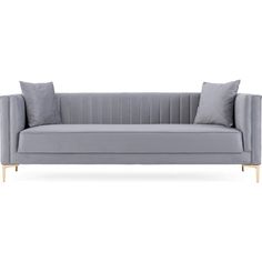 a grey couch with two pillows on it and one arm folded back to the side