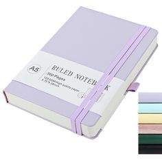 a5 lined note book with elastic band in pastel purple, white and black