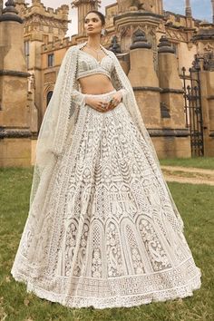 Beige attached cancan lehenga with metallic thread, sequin, pearl embroidery in mughal pattern. Paired with sweetheart neck embroidered padded blouse and cutwork border embroidered dupatta. - Aza Fashions Sequin Lehenga, Pearl Tassels, Seema Gujral, A Royal Affair, Lehenga Pattern, Pearl Embroidery, Net Lehenga, Red Skirts, Bridal Lehenga