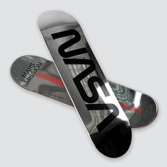 two snowboards are laying on top of each other