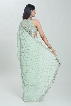 Sea green saree with all-over sequins buttis and sheesha hand embroidered borders. Comes with coordinating embroidered and padded blouse. - Aza Fashions Festive Sleeveless Pre-draped Saree With Mirror Work, Pista Green Pre-draped Saree With Mirror Work For Navratri, Embellished Semi-stitched Saree, Bollywood Style Pre-draped Sleeveless Saree With Mirror Work, Semi-stitched Sleeveless Pre-draped Saree With Mirror Work, Green Sleeveless Pre-draped Saree For Festive Season, Designer Pista Green Choli With Sequins, Designer Pista Green Sequined Choli, Pista Green Sequined Choli For Designer Wear