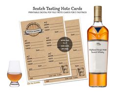 a bottle of scotch tasting note cards next to a glass with a drink in it