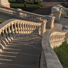 the stairs are made of stone and have balconies on each handrails