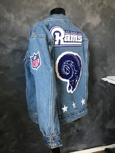 Custom made to order ONE OF A KIND team jackets. Listing includes, LADIES 1 denim jacket (Levi's Women's Ex Boyfriend Trucker Jacket) personalized with your choice of, 1 Back Name Chenille PATCH 1 Front name (embroidered) PATCH 1 Mascot PATCH up to 10inches 3 embroidered stars Official NBA, MLB, NFL, etc. sleeve patch PATCH GENTS 1 denim jacket (Levi's Men's Original Trucker Jacket) personalized with your choice of, 1 Back Name Chenille PATCH 1 Front name (embroidered) PATCH 1 Mascot  PATCH up t Jean Jacket Patches, Personalized Gift Ideas, Embroidered Stars, Team Jackets, Chenille Patch