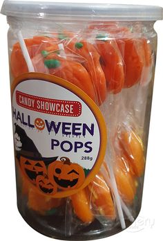 halloween candy in a plastic container on a white background