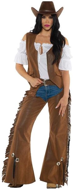 a woman in a cowboy outfit posing for the camera