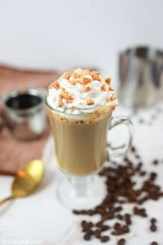 a cup of coffee with whipped cream on top