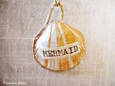 an ornament with the word mermaid written on it