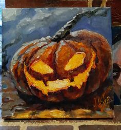 a painting of a jack o lantern pumpkin