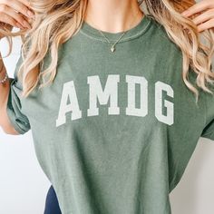 Catholic AMDG Shirt Distressed Catholic Teeshirt Catholic Gift Her Catholic Gift Teen Comfort Colors Shirt Catholic Subtle Catholic Shirt - Etsy Comfortable Cotton Tops For College, Cotton Tops With Lettering For Loungewear, Green Cotton T-shirt With Lettering, Casual College Tops With Lettering, Casual Tops With Lettering For College, Green Top With Lettering And Relaxed Fit, Green Top With Lettering In Relaxed Fit, Green Relaxed Fit Top With Lettering, Catholic Shirt