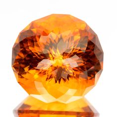 an orange diamond on a white background