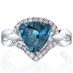 Meet us in London Melt into the precious moments of your day (and night) with the sweet whispers of our London Blue Topaz. This versatile ring features a triangle shape Peora natural London Blue Topaz gemstone in 14K white gold. Our natural London Blue Topaz gemstones are a unique gift from nature. By cutting them in a way that respects the rough's natural radiance, we ignite their inherent intensity and maximize their brilliance to deliver on our signature Peora standard. Handcrafted in pure 14 Topaz Birthstone Ring, London Topaz, Topaz Birthstone, Blue Topaz Bracelet, Amber Ring, Gemstone Engagement, Round Stud Earrings, Swiss Blue Topaz, Pretty Earrings