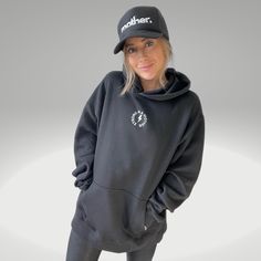 Premium hoodie with a minimalist design printed on the most luxurious and soft no-pill fleece that will stand the test of time. Designed with an oversized fit and no drawcords for a cozy, yet elevated look. Created with intention and with the highest quality fabrics. Wear as a daily reminder of how beautiful and strong you are. Fit: Hoodie is in unisex sizing and designed to have an oversized fit. We recommend your normal sizing or size up for an extra oversized fit. Model is 5'1" and wearing a Strong As A Mother, Black Trucker Hat, Mom Hats, Women's Headwear, Women's Hats, Mother Quotes, Mom Advice, Oversized Hoodie, Children In Need