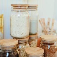 jars filled with different types of food on top of a table