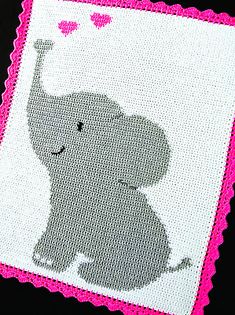 an elephant with hearts on it's head is shown in pink and white crochet