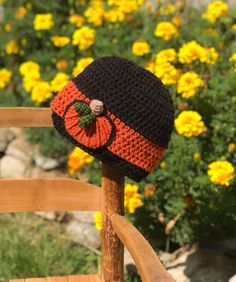 "This black and orange beanie embellished with a pumpkin appliqué is fall perfection! All hand made from my original design, this hat is warm and fun. This hat is made in acrylic yarns. Please select desired size. Hat sizing info: 0-3 months: 15\" circumference 3-6 months: 17\" circumference 6-12 months: 18\" circumference 12 months-2T: 19\" circumference 3T-4T: 20\" circumference 4T-tween: 21\" circumference adult small: 22\" circumference adult medium: 23\" circumference adult large: 24\" circ Adjustable Black Crochet Hat For Fall, Black Knitted Hat For Halloween, Adjustable Hand Knitted Crochet Hat For Fall, Cute Adjustable Black Crochet Hat, Handmade Beanie For Fall, Handmade Fitted Crochet Hat For Fall, Pumpkin Hat Crochet, Orange Beanie, Orange Accessories